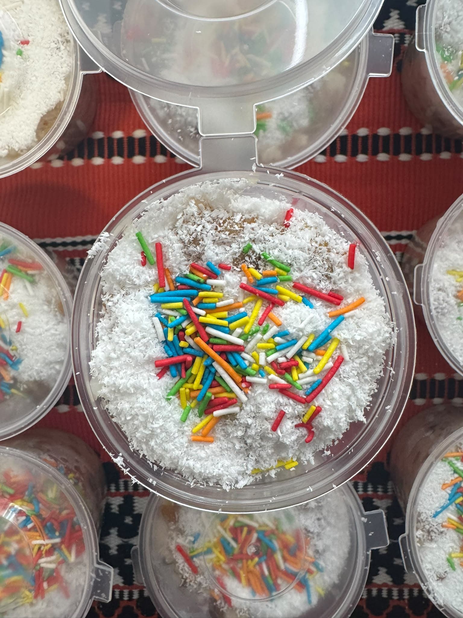 Colivă in an individual container, with coconut and coloured sprinkles