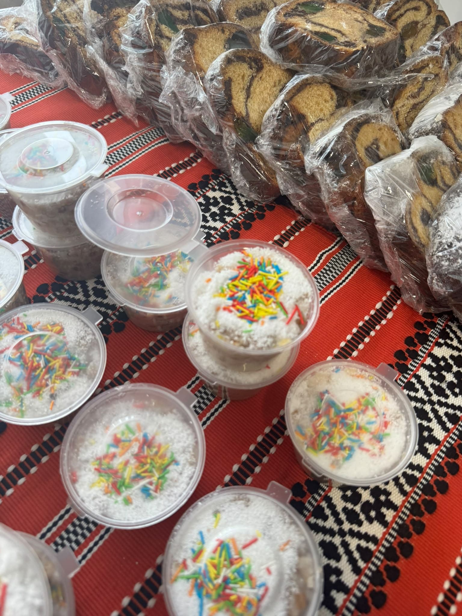 Containers of colivă and wrapped slices of cozonac, ready to hand out