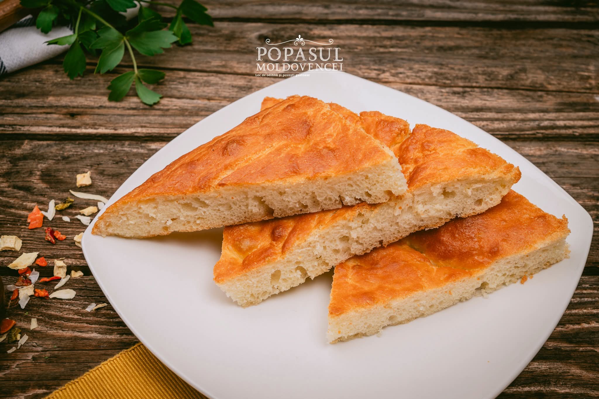 Slices of homemade focaccia on a white plate